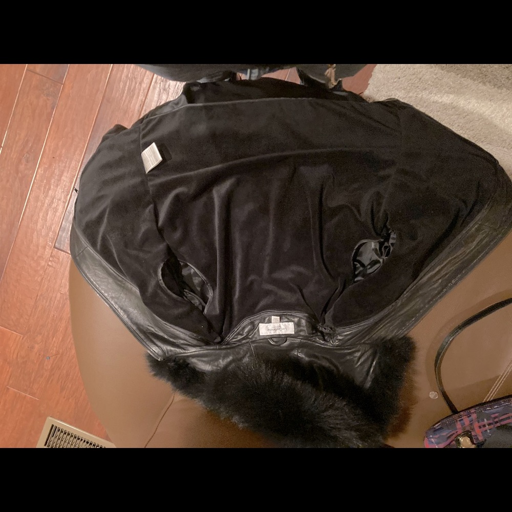 Women’s leather jacket with fox fur lined hood.